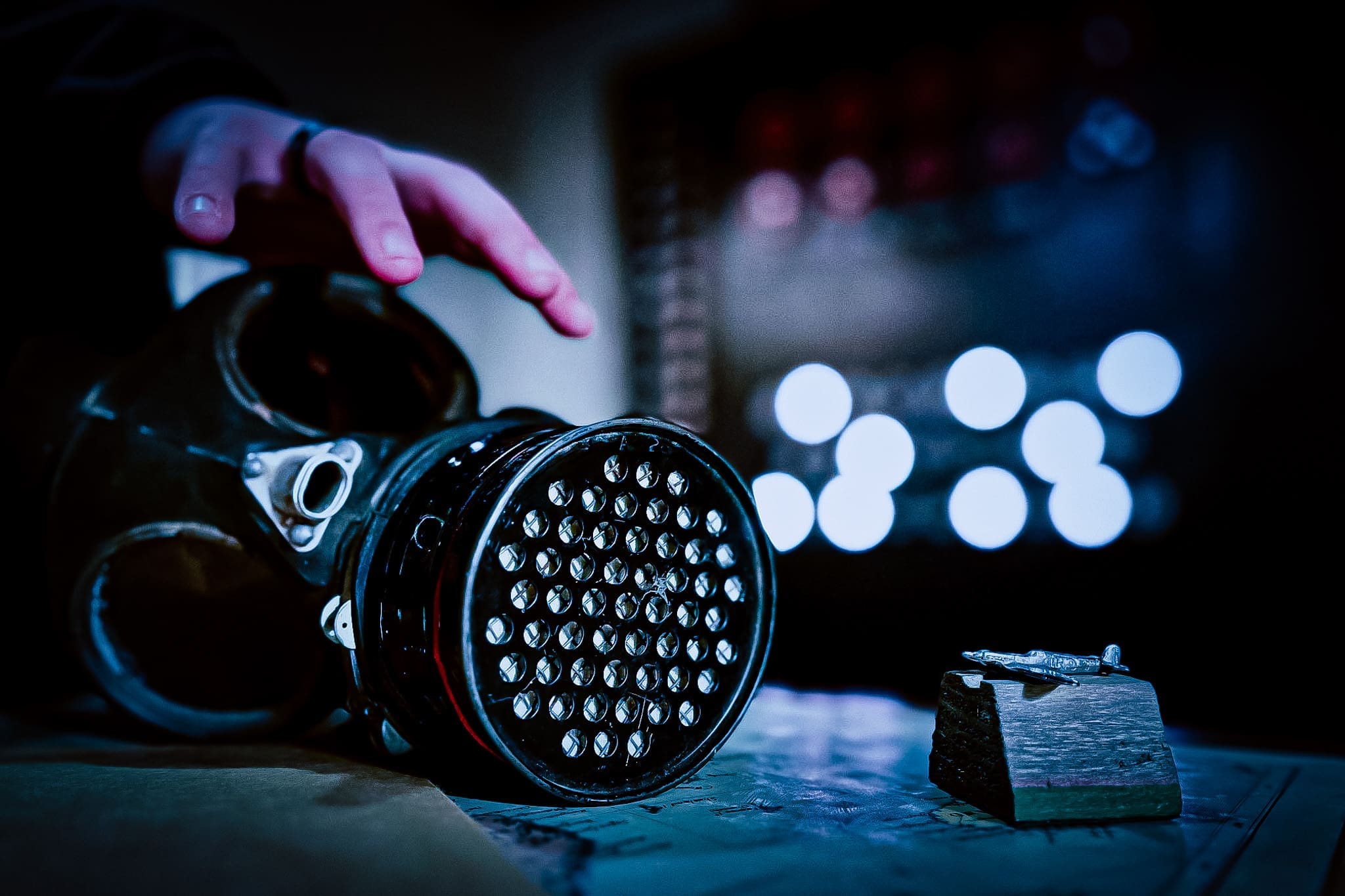 A guest reaching for a clue in Cipher Escape Rooms